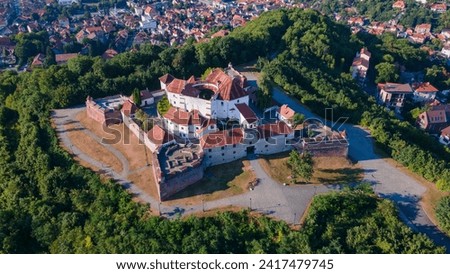 Landscape photography of the modern star shaped fortification in Brasov, Romania. Photography was taken from a drone at a higher altitude with camera lowered for a top view shot of the bastion.