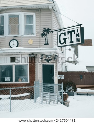 G  T Inn vintage sign in the snow, Buffalo, New York