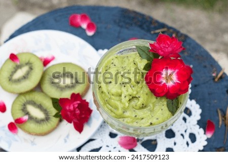 bright green mousse dessert of avocado and kiwi with chia seeds top view. High quality photo