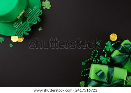 Clover charms: St. Patrick's Day festivities and surprises. Top view shot of present boxes, leprechaun hat, party glasses, trefoils, coins, beads on black background with advert space
