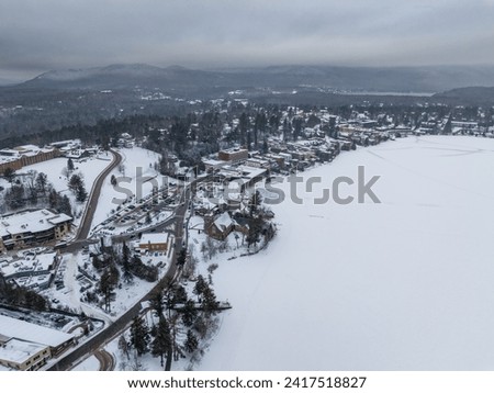 Afternoon winter aerial photo of Mirror Lake in the Village of Lake Placid, New York. (01-05-2024)