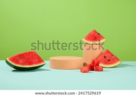 Watermelon is a cooling fruit in the summer. Empty platforms are displayed with fresh watermelon on a green background. Advertising space with front view.