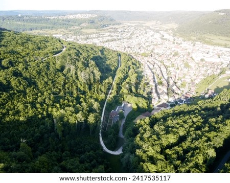  Aerial drone landscape photo of national park. Picture of green forest and road inside the forest and park. Popular travel destination for tourism in Europe. High quality photo