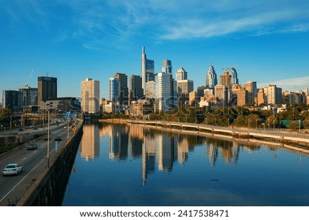 City skyline with historic and modern buildings over river in Philadelphia in Pennsylvania USA 