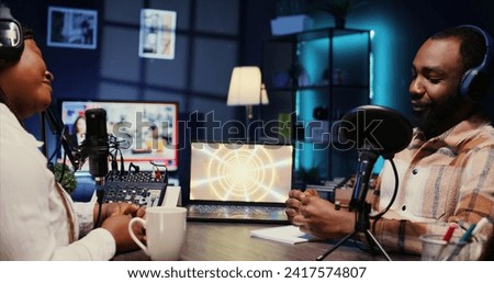 Woman radio show presenter having live conversation with man, recording discussion for audience listening live. Influencer enjoying chat with journalist, broadcasting discussion for fans at home
