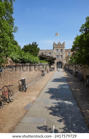The walled passage or Chimney (little path) that leads  to the Porter's Lodge and to First court of Jesus College. Cambridge. Cambridgeshire. United Kingdom Royalty-Free Stock Photo #2417579729