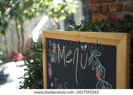 Cafe menu on black board outdoor 