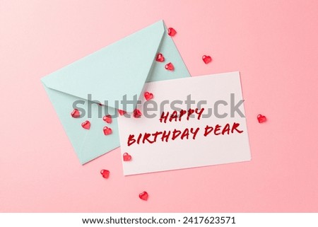 Happy birthday dear wishing card with blank colored envelope with pink background.Retro. Trendy color.