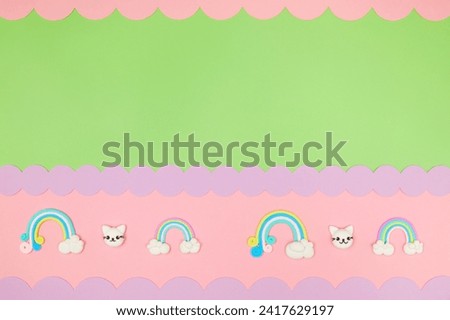 Trendy pastel green kawaii flyer background design template with cute air plasticine handmade cartoon animals, rainbows pattern border. Top view, flat lay. Candycore, fairycore.