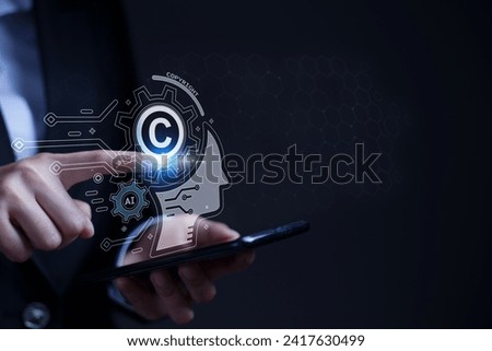 Legal concepts regarding copyright and patents on intellectual property arising from AI technology. Royalty-Free Stock Photo #2417630499