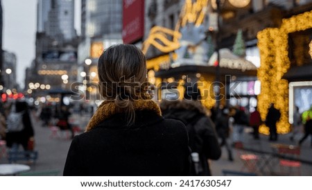 Unidentified people walking in Times Square in New York. Times Square is a major tourist attraction in New York City.Alone Women, Building, Travel, View, Cityscape, Street, Wallpaper, Christmas market Royalty-Free Stock Photo #2417630547
