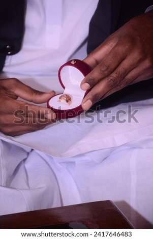Gold Ring ceremony for groom