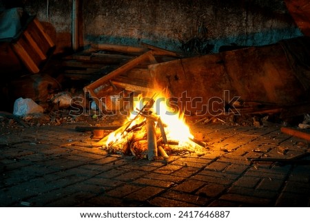 Bonfire at night on black background, big burning fire.
