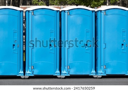 Portable wc. Public mobile toilet in the street. Transportable latrine Royalty-Free Stock Photo #2417650259
