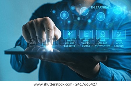 Engaging with Diverse E-Learning Opportunities on Tablet :An individual taps into a variety of e-learning options on a tablet, highlighting the diverse educational content available digitally. Royalty-Free Stock Photo #2417665427