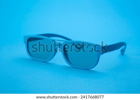 blue background blue glasses stock photo