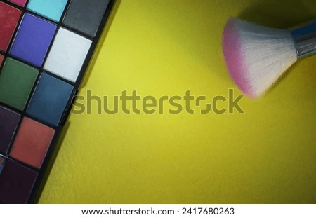 Composition with Makeup Brushes and Eyeshadows. Colorful Shadows, Creative Abstract Design Background Photo. Eyeshadow Palette Background.