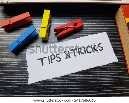 Tips and tricks written on black background.