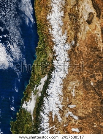 Winter in the Andes. Every austral winter in the central Andes, fresh snowfall covers and fills the gaps between mountaintops that have more. Elements of this image furnished by NASA.