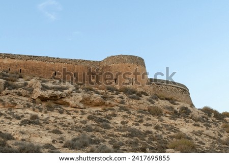 Castle or battery of San Ramón in Rodalquilar, Almería, Spain. View of the walls of the coastal defense structure built in 1764. Royalty-Free Stock Photo #2417695855