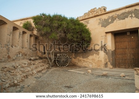 Castle or battery of San Ramon in Rodalquilar, Almeria, Spain. View of the entrance and walls of the coastal defense structure built in 1764. Royalty-Free Stock Photo #2417698615