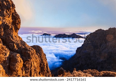 idyllic mountain landscape of Gran Canaria (Grand Canary) Canarian island of Spain, sunset over clouds Royalty-Free Stock Photo #2417716161