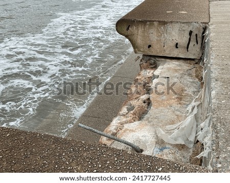 Destruction and damage of sea wall defensive structure and wave deflection units on coastal promenade at Dawlish in Devon after violent storms
 Royalty-Free Stock Photo #2417727445