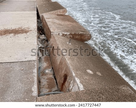 Destruction and damage of sea wall defensive structure and wave deflection units on coastal promenade at Dawlish in Devon after violent storms
 Royalty-Free Stock Photo #2417727447