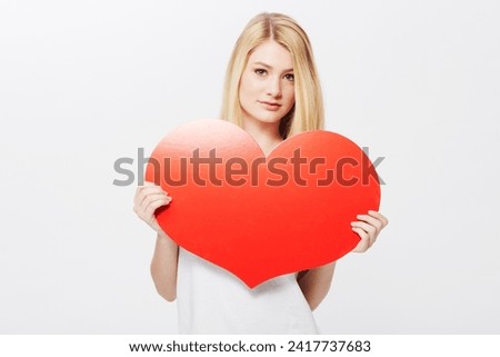 Woman, portrait and heart or poster mockup or Valentines message, announcement or bulletin. Female person, model and face or white background in studio as love gesture or billboard, placard or banner