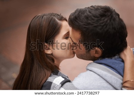 Love, city and face of couple kiss, bonding together and enjoy outdoor date with care, support and partner commitment. Devotion, relationship connection and romantic people in sweet intimate moment Royalty-Free Stock Photo #2417738297