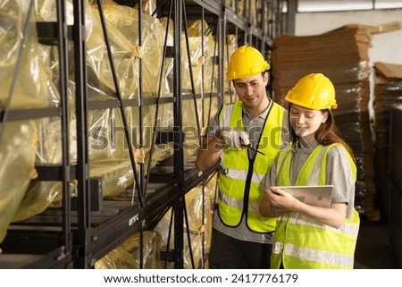 Warehouse worker and managers check stock and inventory by using digital tablet computer in the retail warehouse full of shelves with goods. Working in logistics and distribution center.