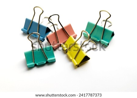Paper clips, Paper clips on white background, colour paper clips on white background. Royalty-Free Stock Photo #2417787373