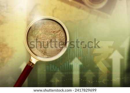 Magnifying glass on vintage retro India map currency upgrade. Vintage camera on antique Indian map. Indian currency Up. Increasing Indian currency.