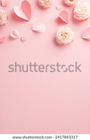 Elevate Women's Day for your glamorous partner! A captivating vertical top view of roses and sweet hearts on a pastel pink surface. Ample space for your affectionate message or promotion