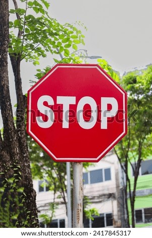 This stock photo features a red octagonal stop sign with the words "Stop" written in white text