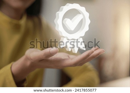 Hand shows the sign of the top service Quality assurance, Guarantee, Standards, ISO certification and standardization concept.	