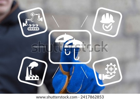 Industrial worker using virtual touchscreen presses icon: two umbrella. Industry Insurance Protection Safety Technology Concept. Royalty-Free Stock Photo #2417862853