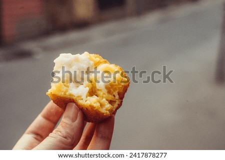 Sicilian Arancini, traditional Sicilian rice ball with cheese and corn stuffing Royalty-Free Stock Photo #2417878277