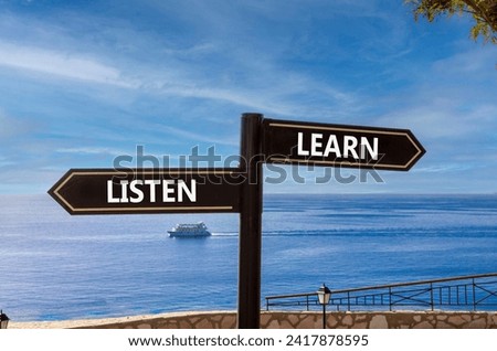 Listen and learn symbol. Concept word Listen and Learn on beautiful signpost with two arrows. Beautiful blue sea sky with clouds background. Business and listen and learn concept. Copy space.