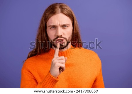 Photo portrait of young strict man keep secret forefinger gesture mouth shut up please be silent isolated over violet color background Royalty-Free Stock Photo #2417908859