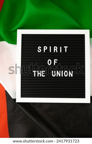Text SPIRIT OF THE UNION on background flag of UAE. National holiday of United Arab Emirates. Commemoration Day Muslim Arabian holidays. Dubai