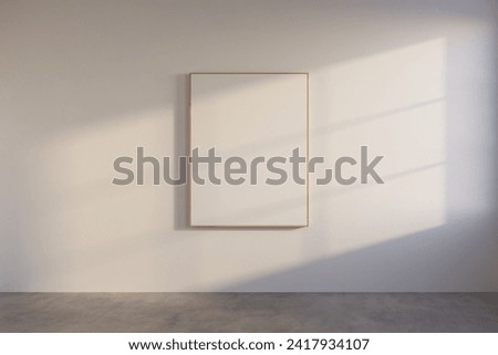 Mockup rectangle frame in minimalist interior background. Empty frame with natural sunlight on white wall.