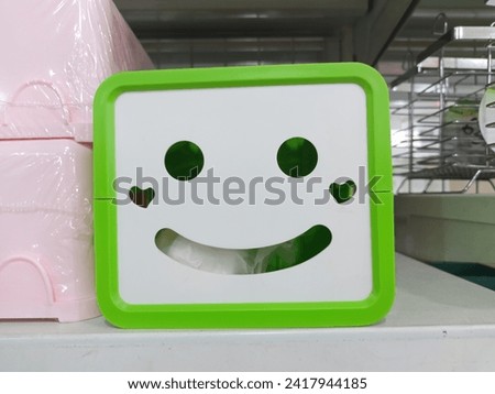 plastic tissue box with a smile shape