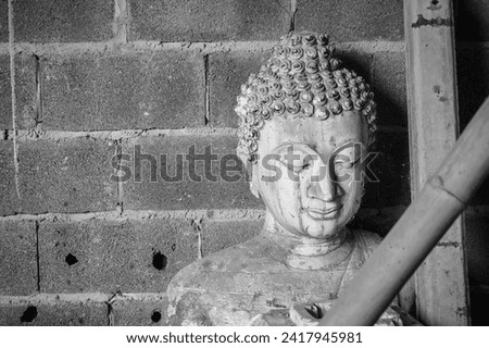 Buddha sandstone statue in temple Thailand, Black and white picture.