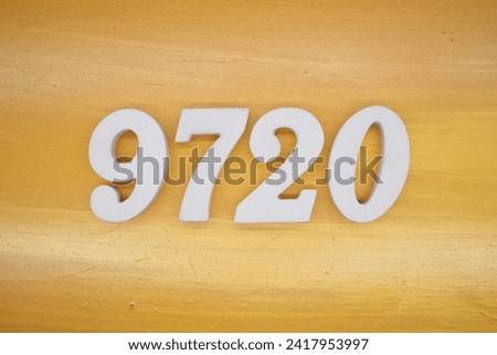 The golden yellow painted wood panel for the background, number 9720, is made from white painted wood.