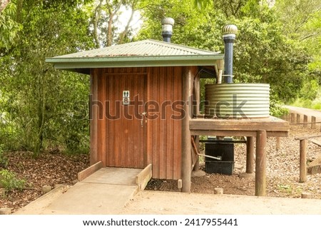 An environmentally friendly public toilet structure with a sealed unit and water tank at Hastie's Swamp on the Atherton Tablelands in Queensland, Australia.