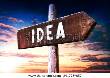 Idea - wooden signpost with one arrow, sunset sky in background
