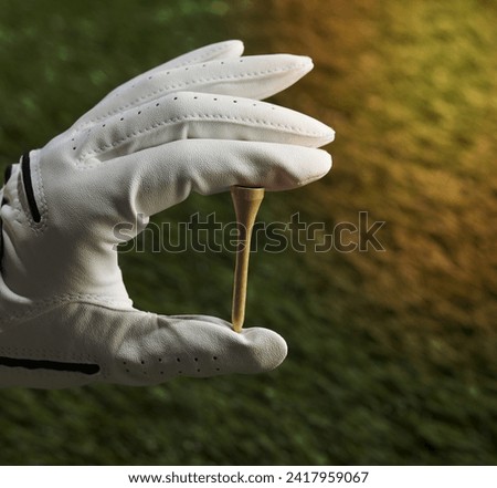 Human Hand Holding Golf Tee
