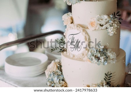 It could be a wedding cake or a birthday cake, and it is decorated with flowers.