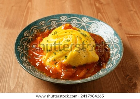 Tornado omurice. omelet(omelette) and rice Royalty-Free Stock Photo #2417984265